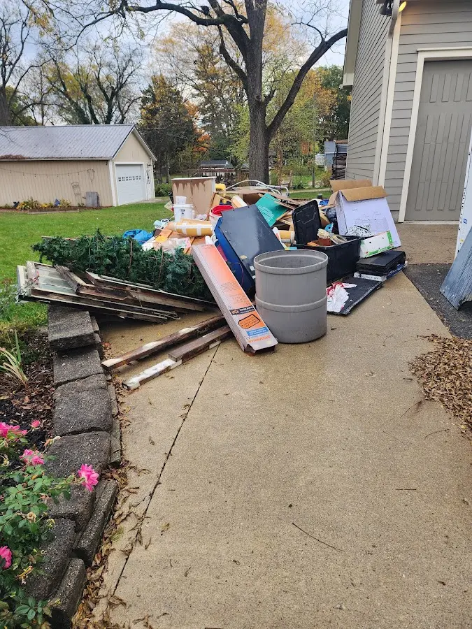 Dumpster being loaded with debris for 30 Yard Dumpster Rental in Bluefield
